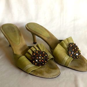 Leather muted green slip-on heels with orange rhinestone embellishment.